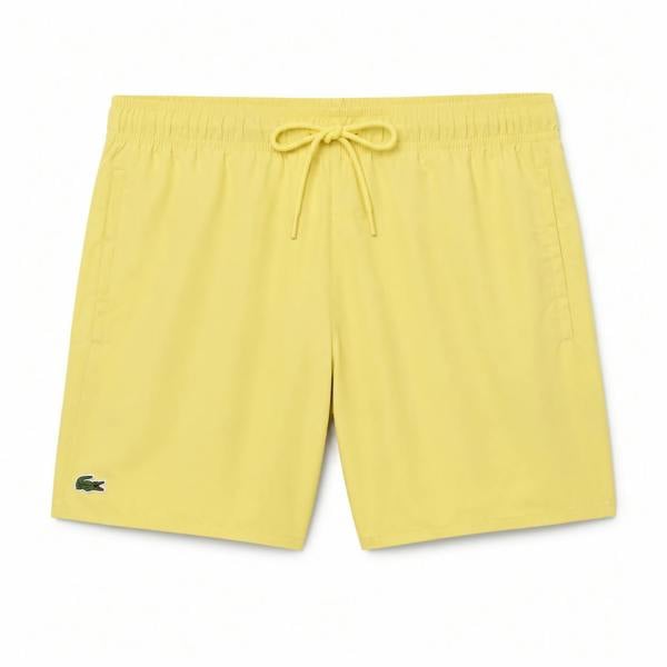 Lacoste yellow quick-dry swim shorts with drawstring waist and green crocodile logo.