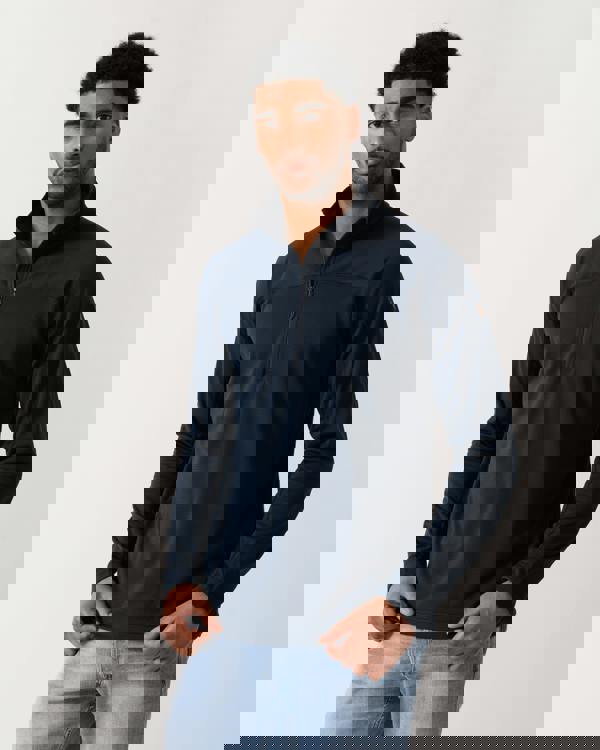 model wearing a Fjallraven Abisko Lite Fleece Half Zip Mens Sweatshirt in Dark Navy 555