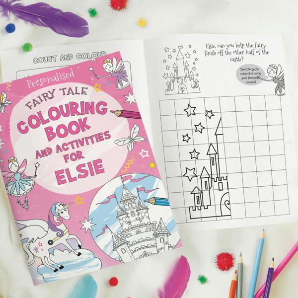 Open personalised fairy tale colouring book showing a grid drawing activity to finish drawing the castle for Elsie next to the front cover