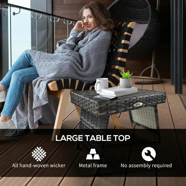 Grey woven rattan side table with drinkware on top and four folding legs