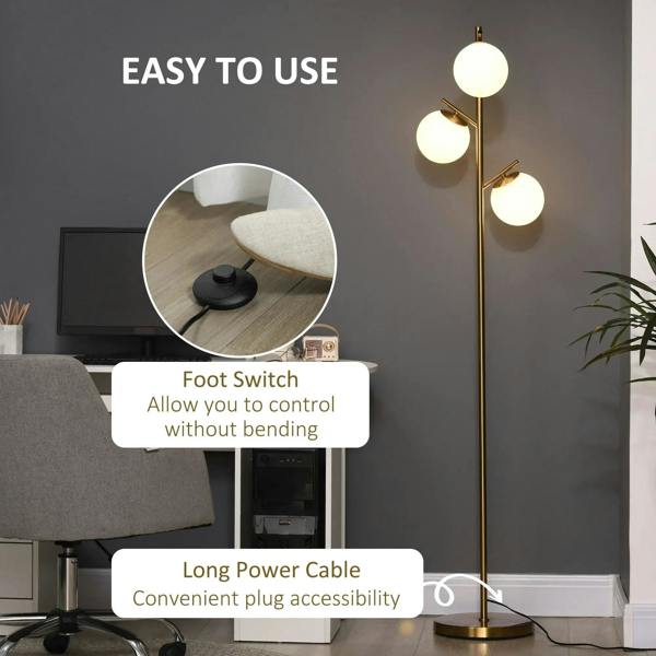 Gold three-light floor lamp with three round globe shades and long power cable