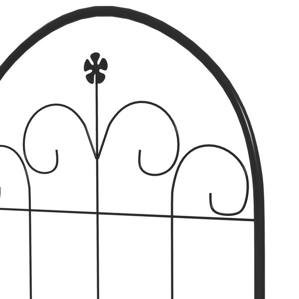 Close-up of black metal trellis arched top with floral finial and curled scrollwork