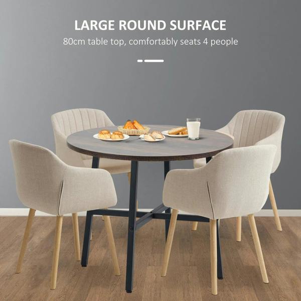 Round table with rustic brown surface and black steel frame, set for four