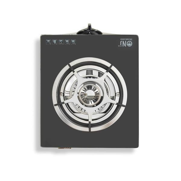 Gas stove with black surface and silver burner on a white background