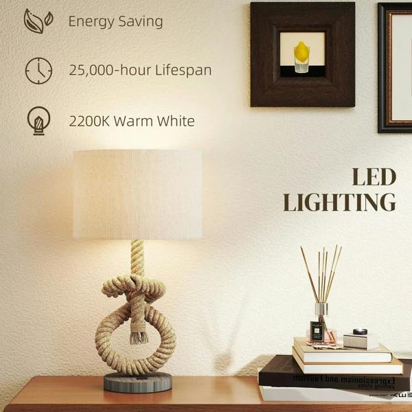 Hemp rope table lamp with cream shade and visible glowing light on base