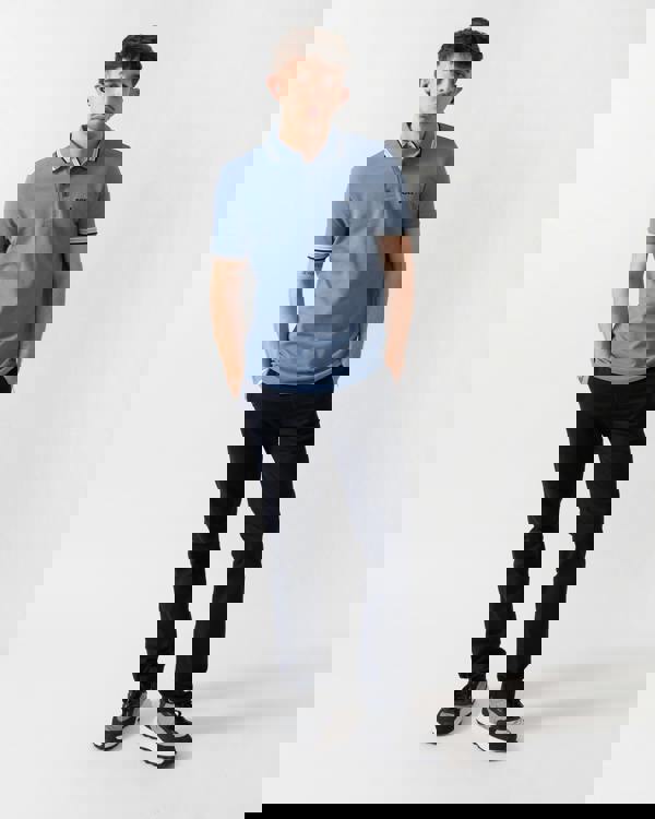 full length shot of a model wearing a BOSS Green Paddy Mens Cotton-Piqué Polo Shirt with Contrast Logo in Open Blue 462