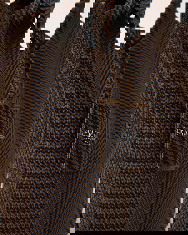 logo detail of Ilse Jacobsen Knitty Womens Knitted Bag in Dark Indigo and Buckthorn Brown