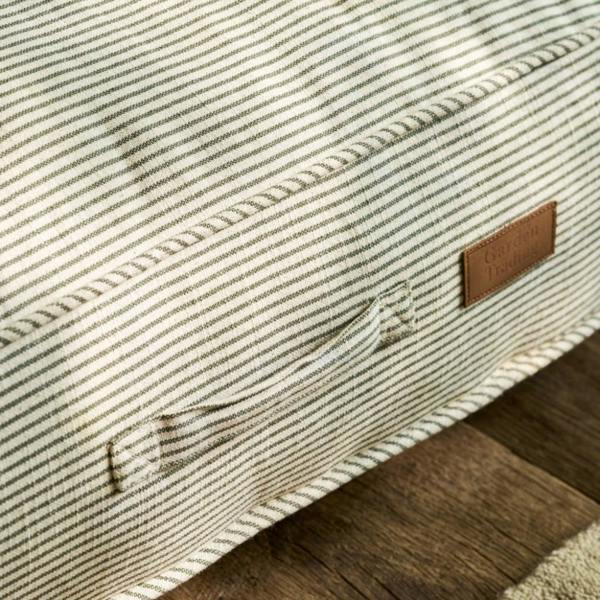 Close-up of the cotton ticking stripe fabric, carry handle, and hidden zip on a pet cushion.
