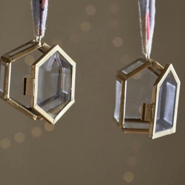 Close-up of the Malvern set of two antique brass and glass box ornaments with their hinged doors swung open to reveal the fillable interior.