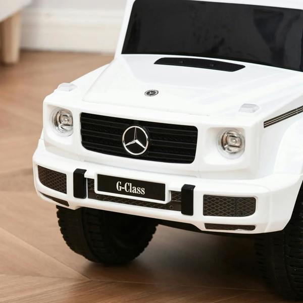 White kids ride-on push car front with Mercedes emblem and G-Class grille details