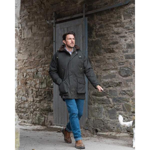 Dog walker wearing the Hoggs of Fife Kelso wax jacket for men