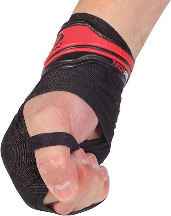 Fist wearing black Optimum Tech Pro boxing wrap with red gel knuckle pad and logo, on white - Optimum