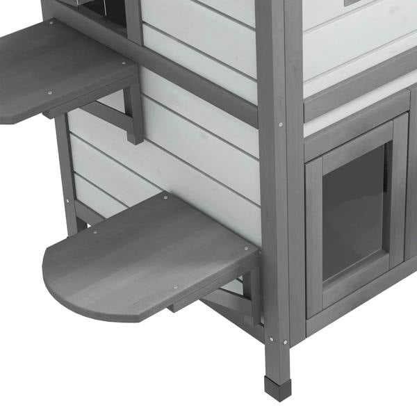 Gray side ramp and platform attached to a white two-story cat house