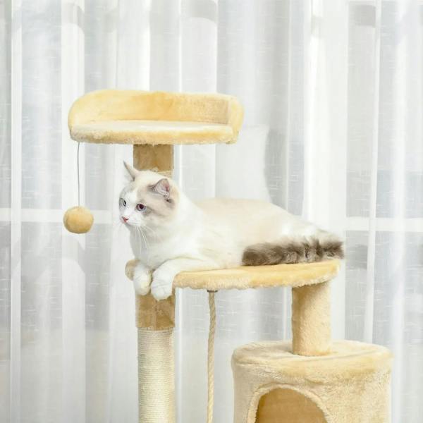 Beige cat tree with top perch, hanging ball toy, and lower condo with kitten