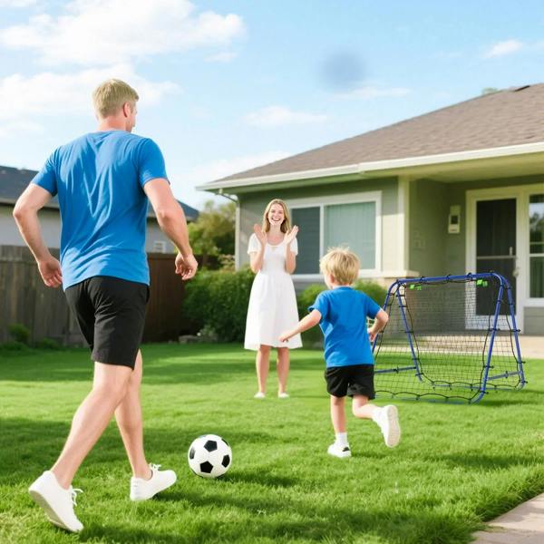 Blue football rebounder goal net on lawn near a child and adult