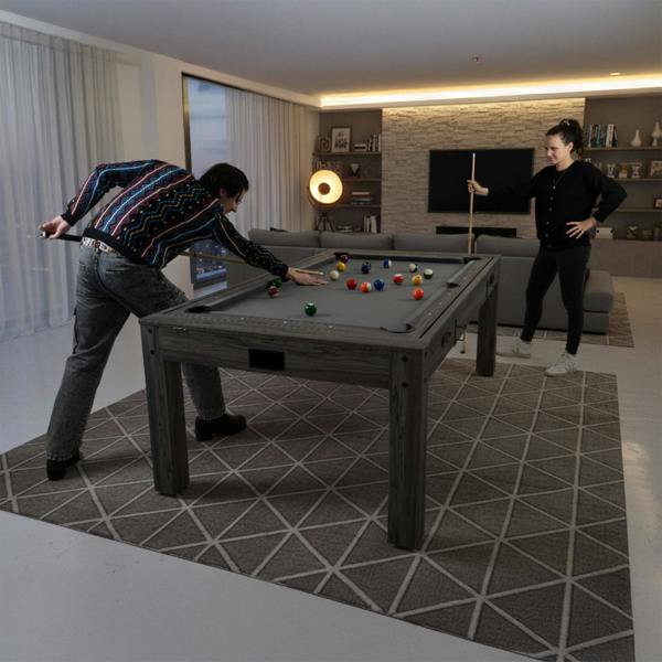 7-In-1 Games Table in grey with a textured surface, featuring players enjoying billiards in a modern living room setting