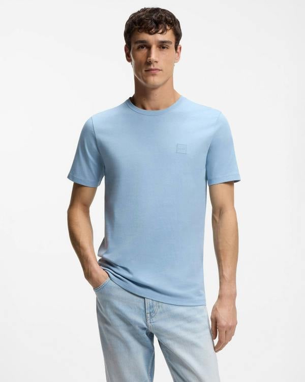 Model wearing BOSS Orange Tales Mens Cotton-Jersey T-shirt With Logo Patch - Light/Pastel Blue 458 - Front