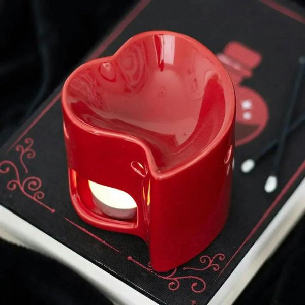 Red heart-shaped wax/oil warmer with side opening and two vent holes