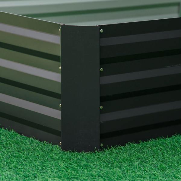 Close-up of metal raised garden bed planter box corner with black powder-coated sides