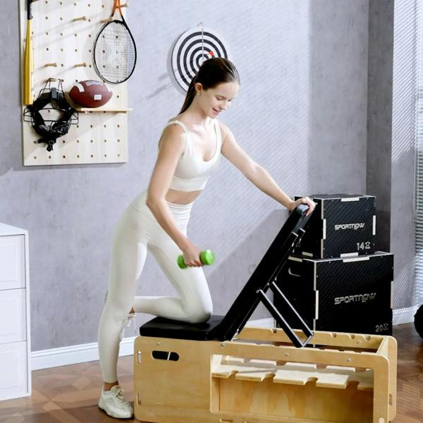 Green hex dumbbell for home training, standing near open storage case on floor
