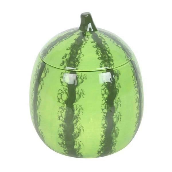 Green watermelon-shaped candle jar with clear lid and stem detail.