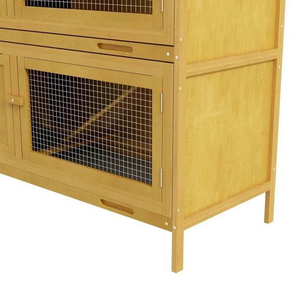Yellow lower front panel of rabbit hutch with wire-mesh door and latch