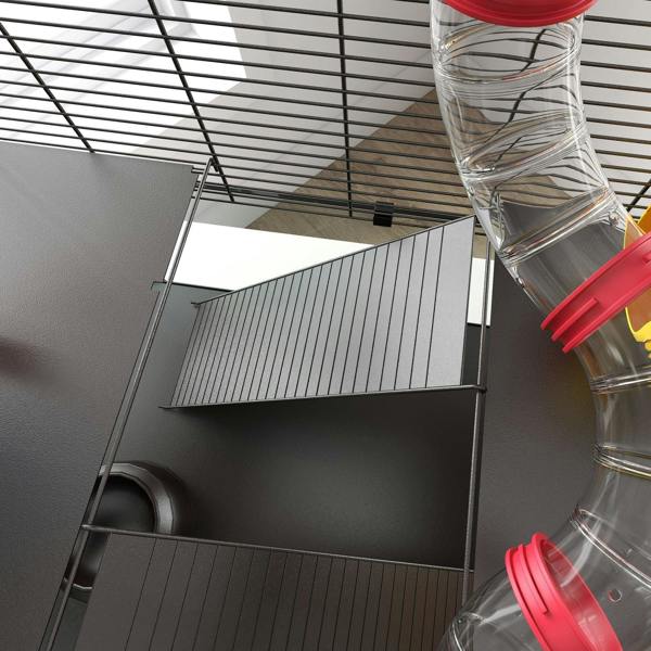 Wire cage interior with red-and-clear connecting tubes and dark tunnel openings