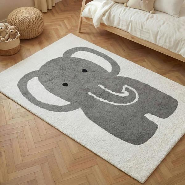 Children's rug with an elephant design on a wooden floor