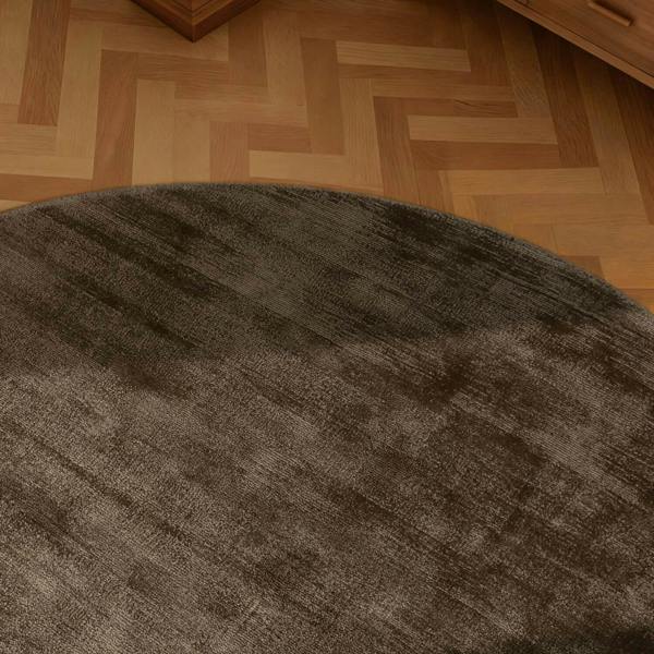 Brown rug on a wooden floor