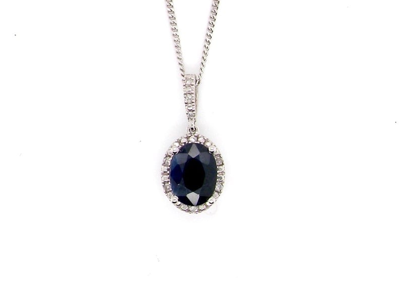  9 carat white gold sapphire and diamond pendant NEW