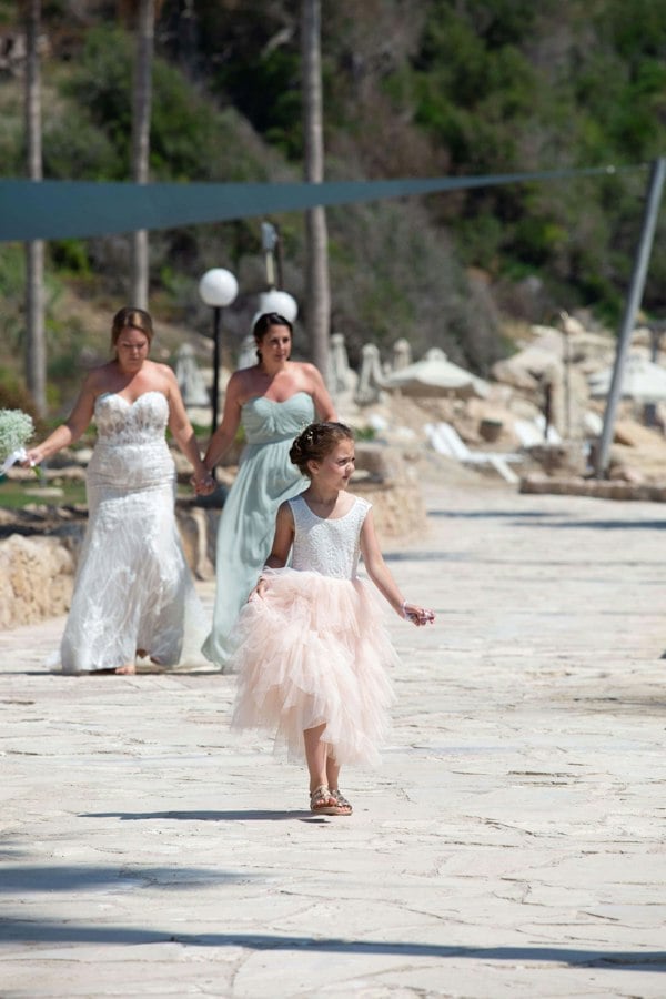 Young girl walking on sand