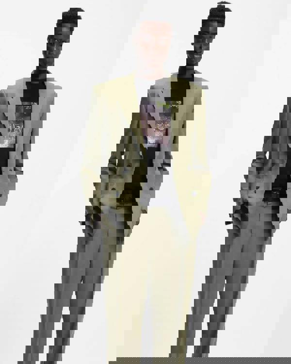 Model wearing Model wearing HUGO Doreston Mens Graphic T-Shirt in Black 001 with a green suit - Front