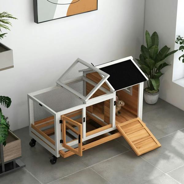 Wooden rabbit hutch with open ramped tray and open roof for easy access