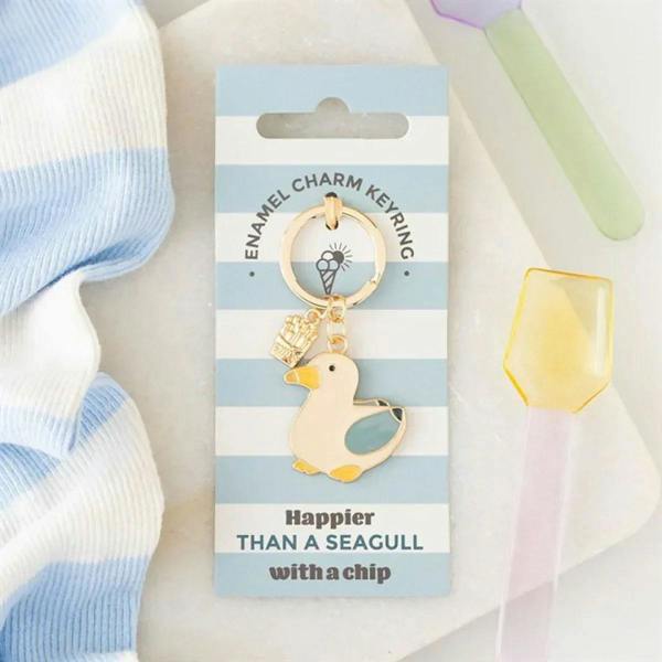 Seagull and chips keyring charm on hanging card, gold-tone with blue enamel