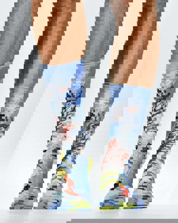 Colorful socks with a design of a person holding a flag on a white background