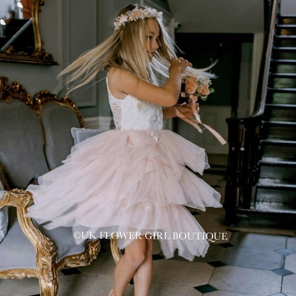 Girl dancing in hallway with flowers