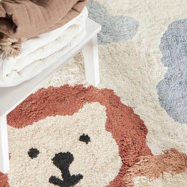 Rug with a lion face design on a neutral background