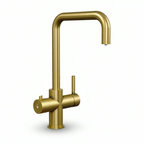 Brushed gold boiling water tap on a white background