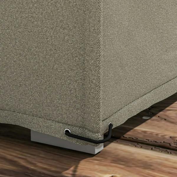 Close-up of grey cover corner with eyelet and tie strap for secure outdoor fastening