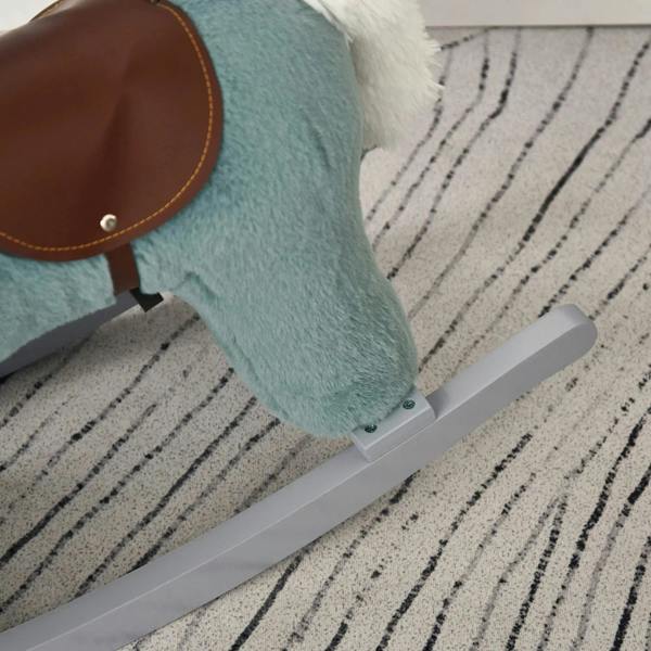 Blue plush rocking horse on gray rocker base, resting on patterned rug