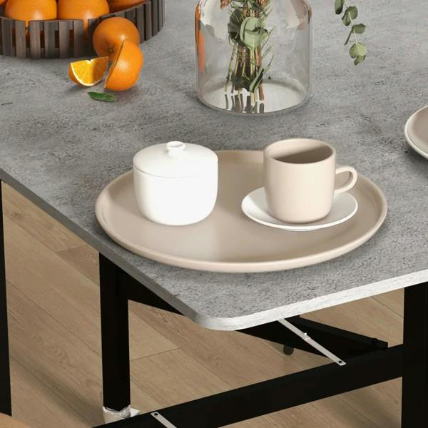 Grey marble-effect tabletop with cup and plate set; black drop-leaf frame visible