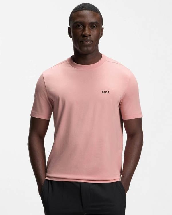 Model wearing BOSS Green Tee Mens Stretch Cotton T-Shirt with Contrast Logo in Light/Pastel Pink 686 - Front