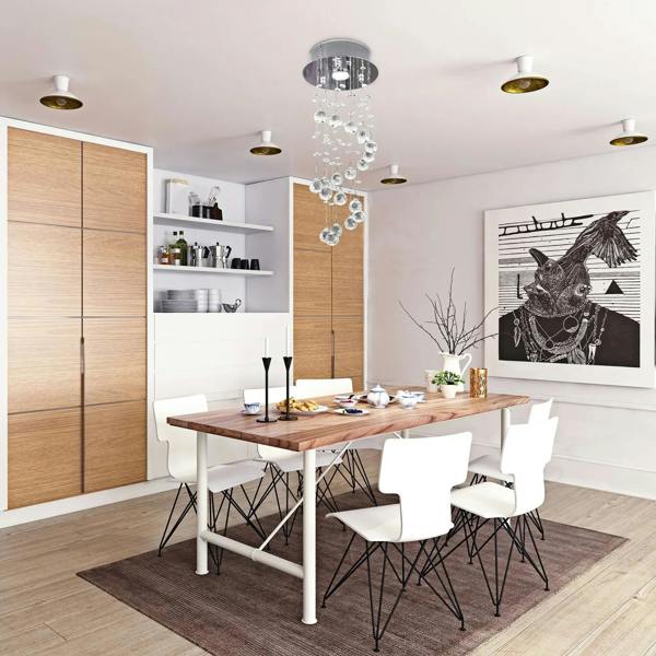 Silver crystal ceiling chandelier with hanging clear glass beads in a modern dining room
