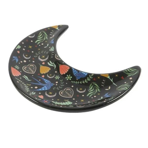 Crescent moon trinket dish with smooth curved tray and colorful floral bird pattern.