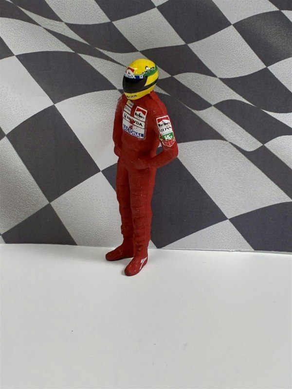 a toy figure in a red uniform