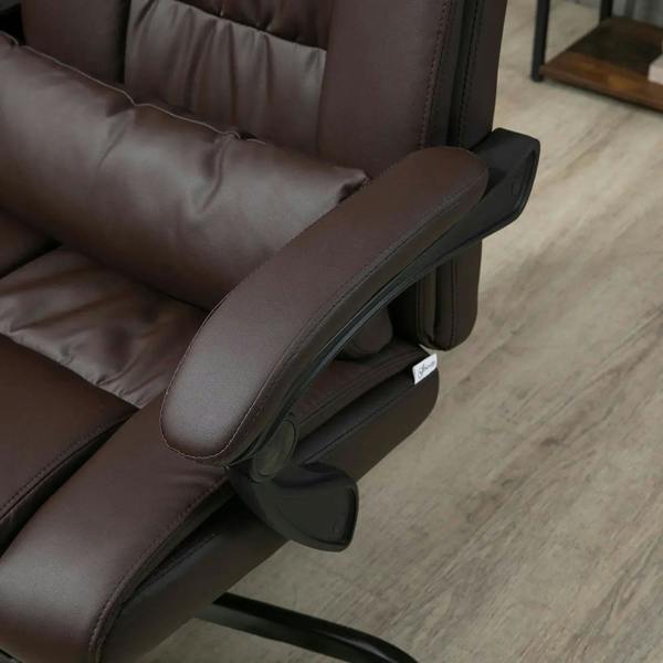 Brown padded office chair armrest and side panel detail near control lever