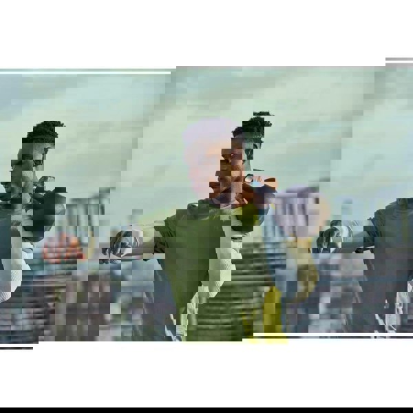 Man working out with an Adidas 16kg Cast Iron Kettlebell 