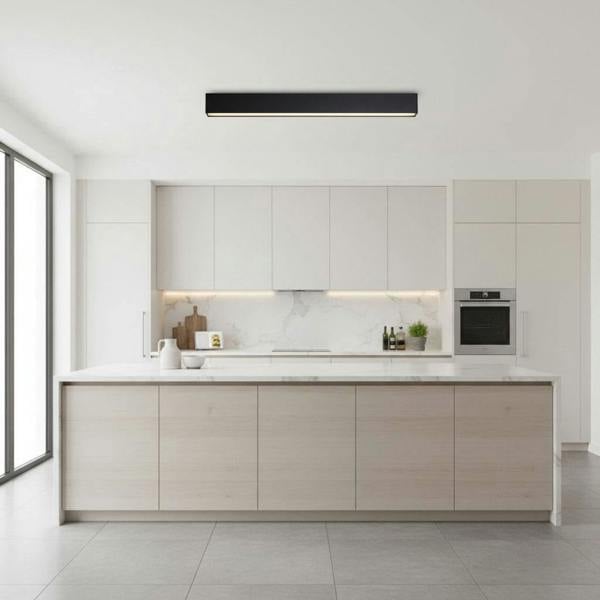 black linear surface downlight mounted on the ceiling in a modern kitchen
