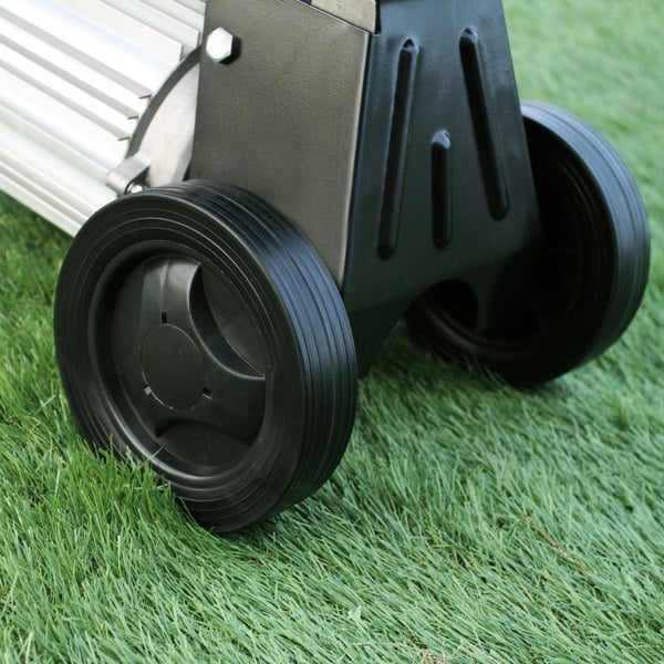 Close-up of T-Mech 5T Log Splitter's sturdy black wheels on grass, showcasing durable rubber material and robust design for easy mobility