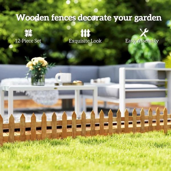 Brown wooden picket fence set for yard edging, pointed stakes along the grass